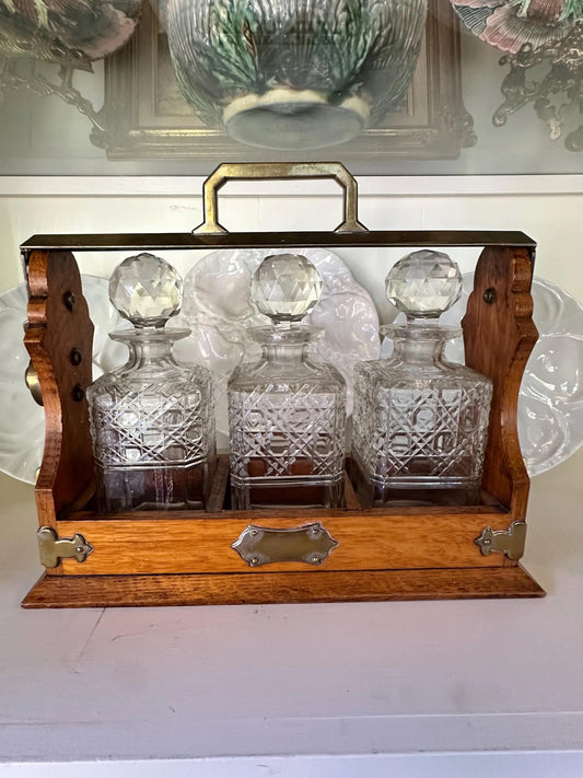 Antique English Oak and Brass Tantalus with Three Cut Glass Decanters